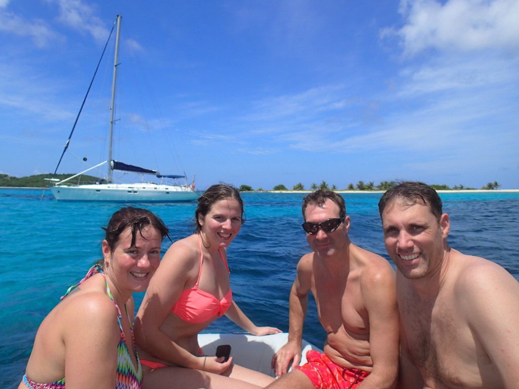 Caribbean sailing charter vacations - yacht with two couples in Tobago Cays
